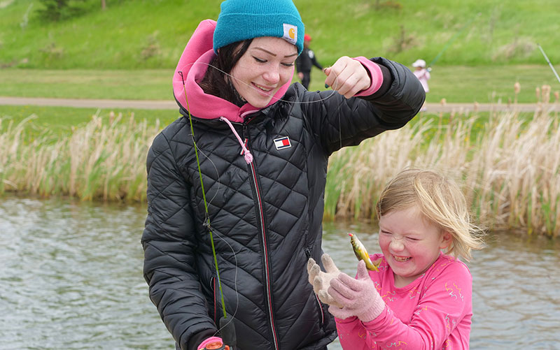 Father and Daughter ice-fishing