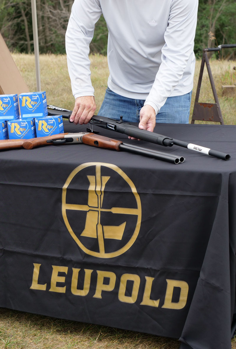 Leupold display with guns and ammunition