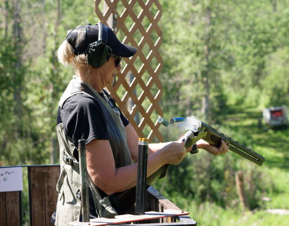 woman unloads shotgun after firing